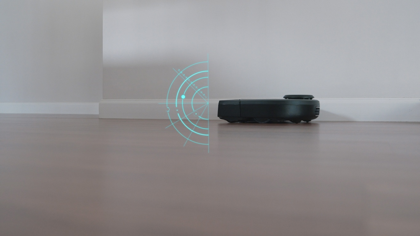side-view-of-robot-vacuum-on-floor-with-green-overlay-indicating-sensor-range
