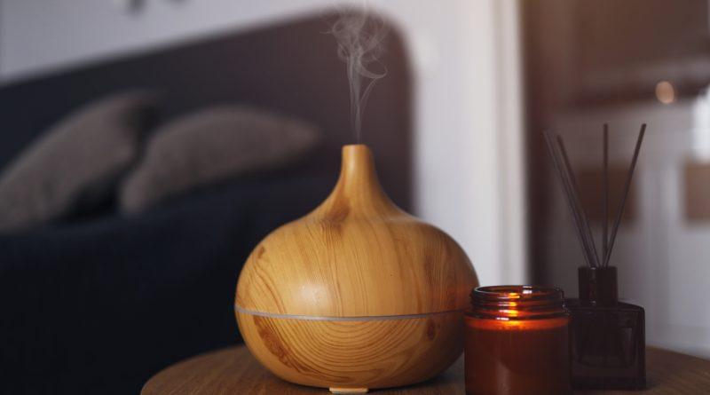 Best home air humidifiers - An air humidifier on a wooden table at home.